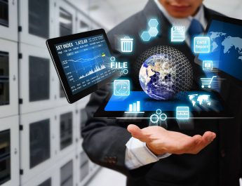 Businessman holding tablet with icons of internet and data storage